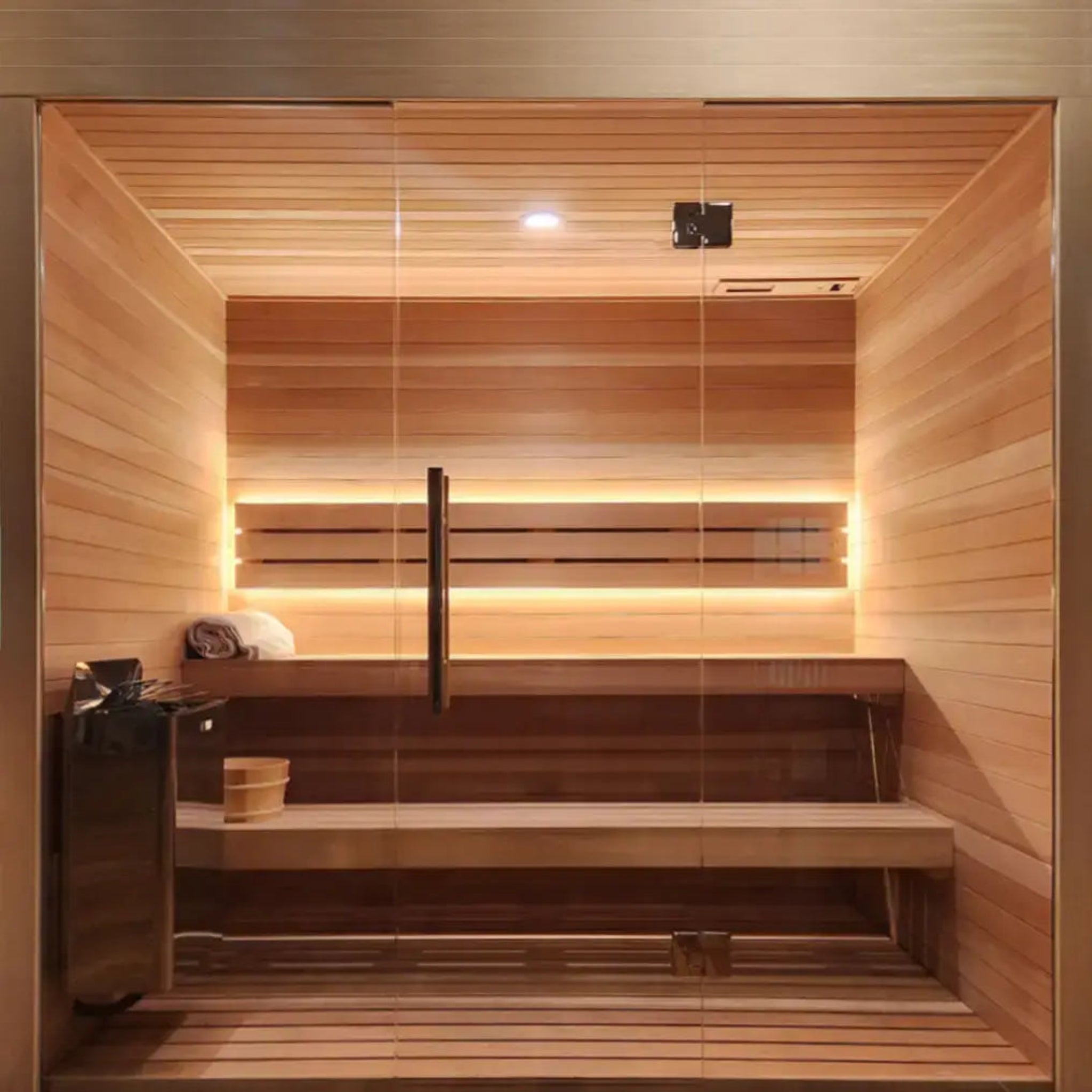 Front view of sauna looking at the heater and bench through the glass door