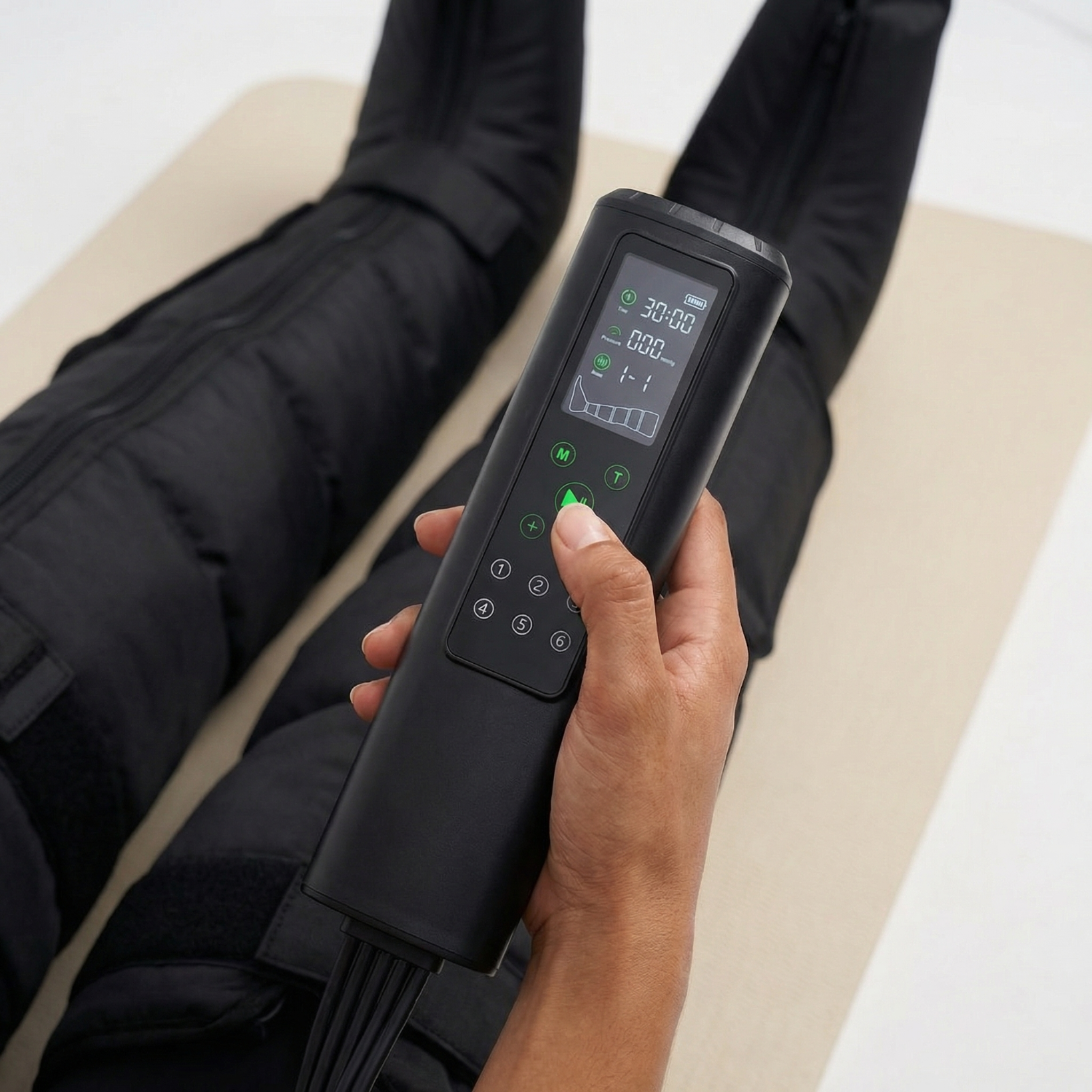 Person using a digital device on a black garment with a white background