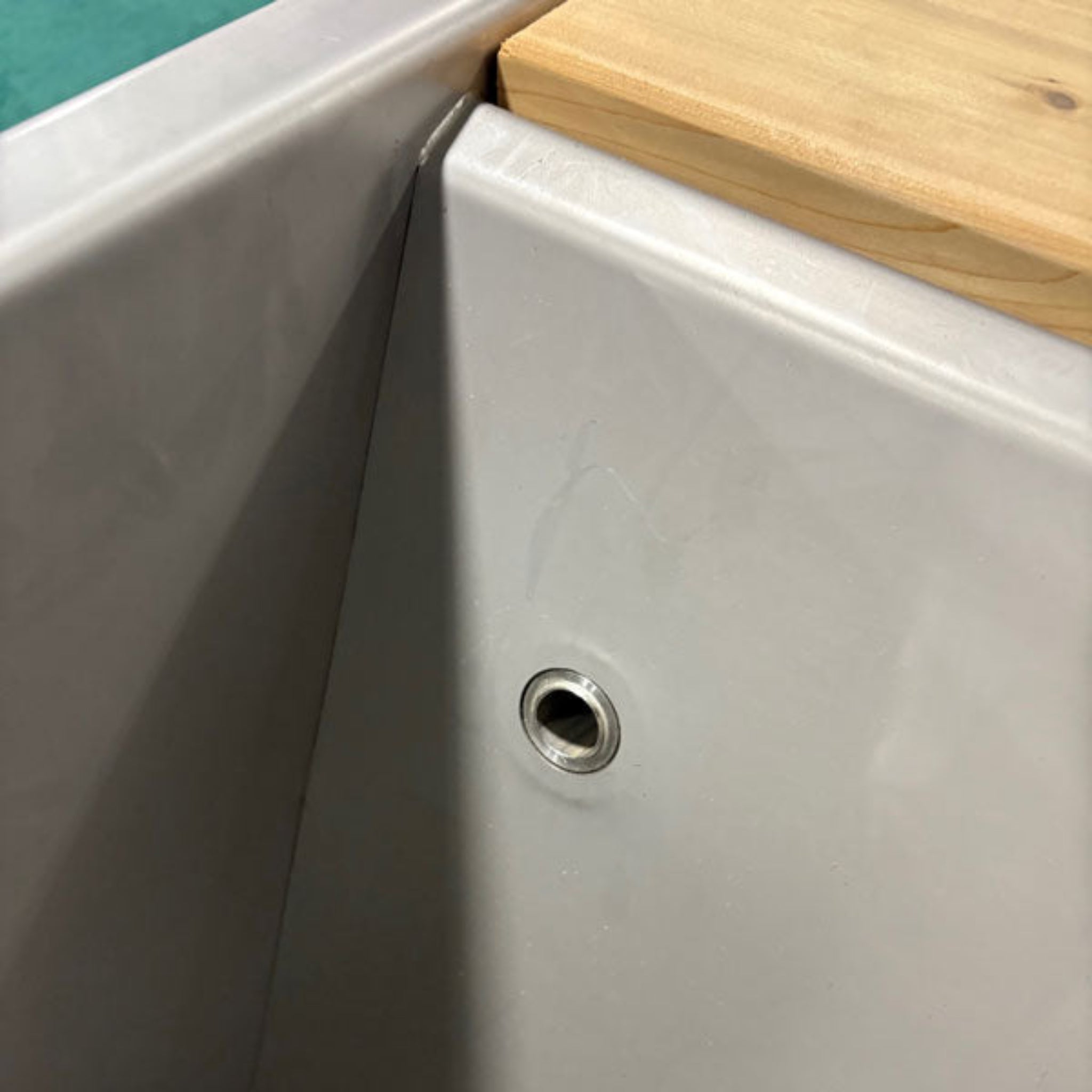 Dundalk LeisureCraft Flow Cold Plunge | Cedar & Stainless Steel interior view showing corner detail and drain fitting.