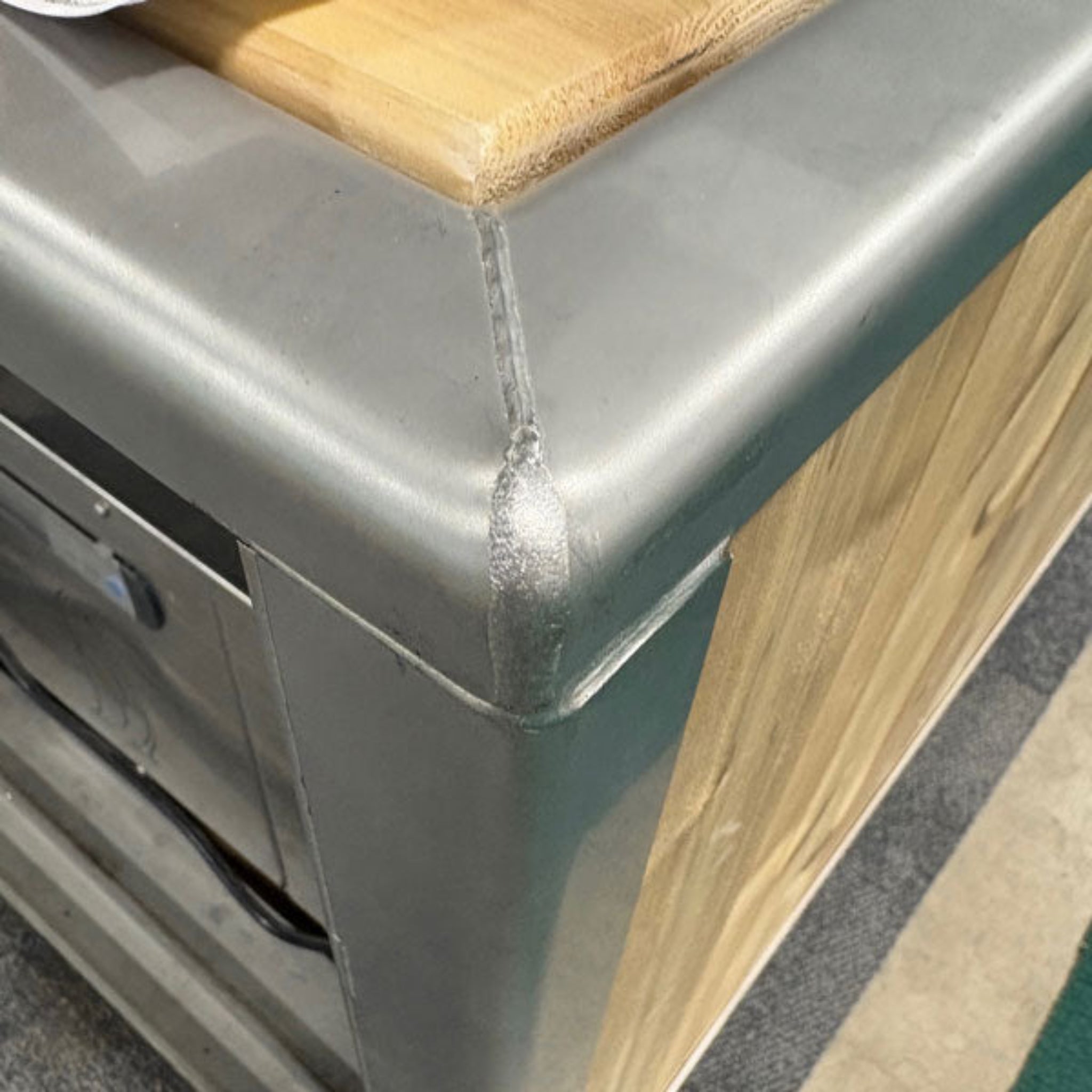 Dundalk LeisureCraft Flow Cold Plunge | Cedar & Stainless Steel corner detail showcasing premium materials.