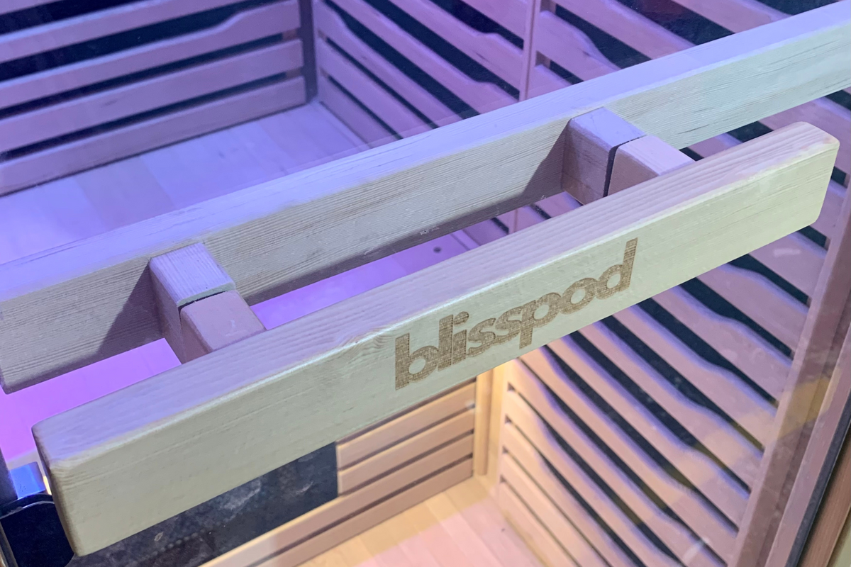 Blisspod brand logo on the wooden handle of a Full Spectrum Indoor Sauna.