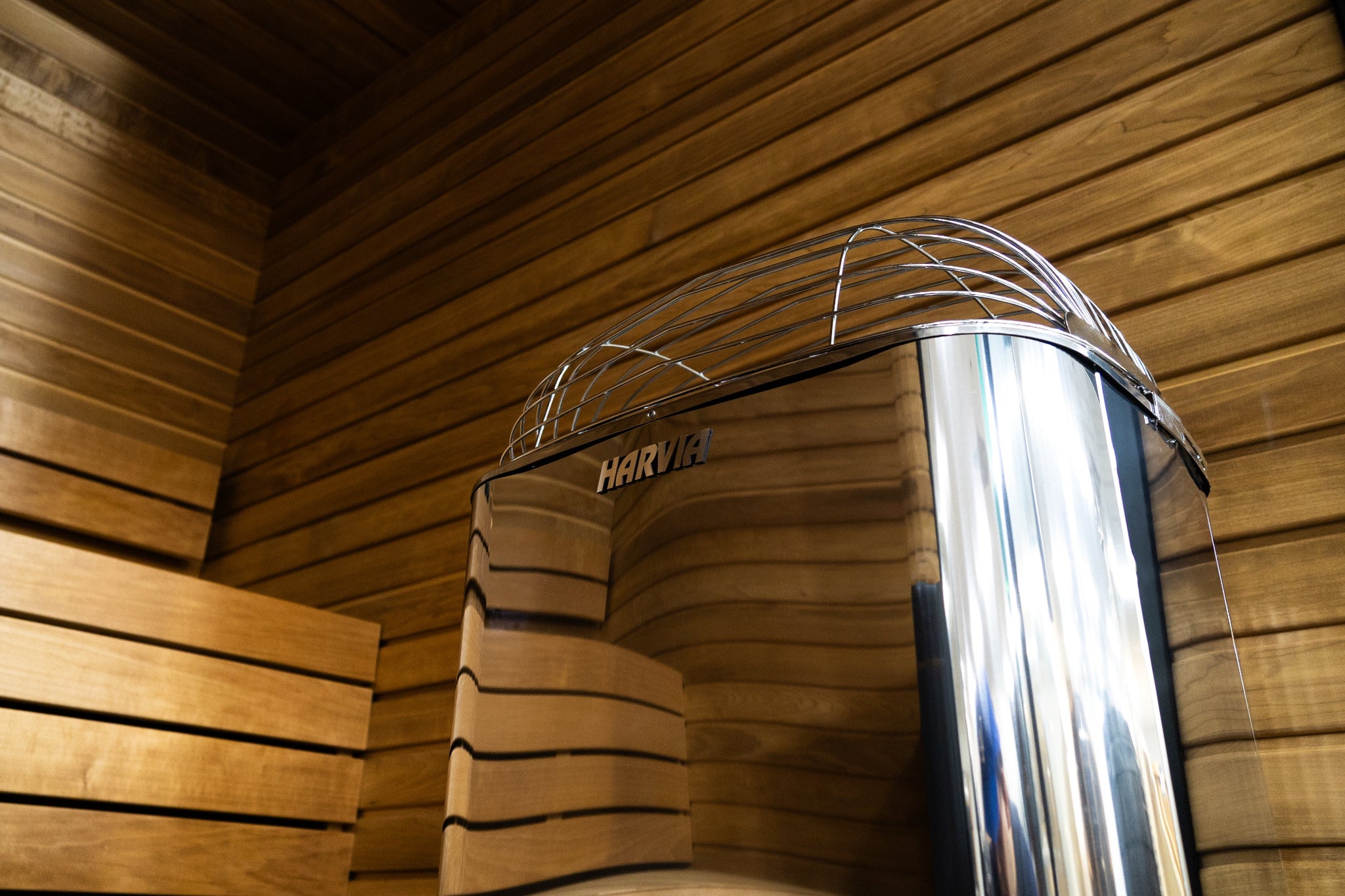 Harvia Club K12.5G sauna heater — lower angle view showing stone basket and heating elements