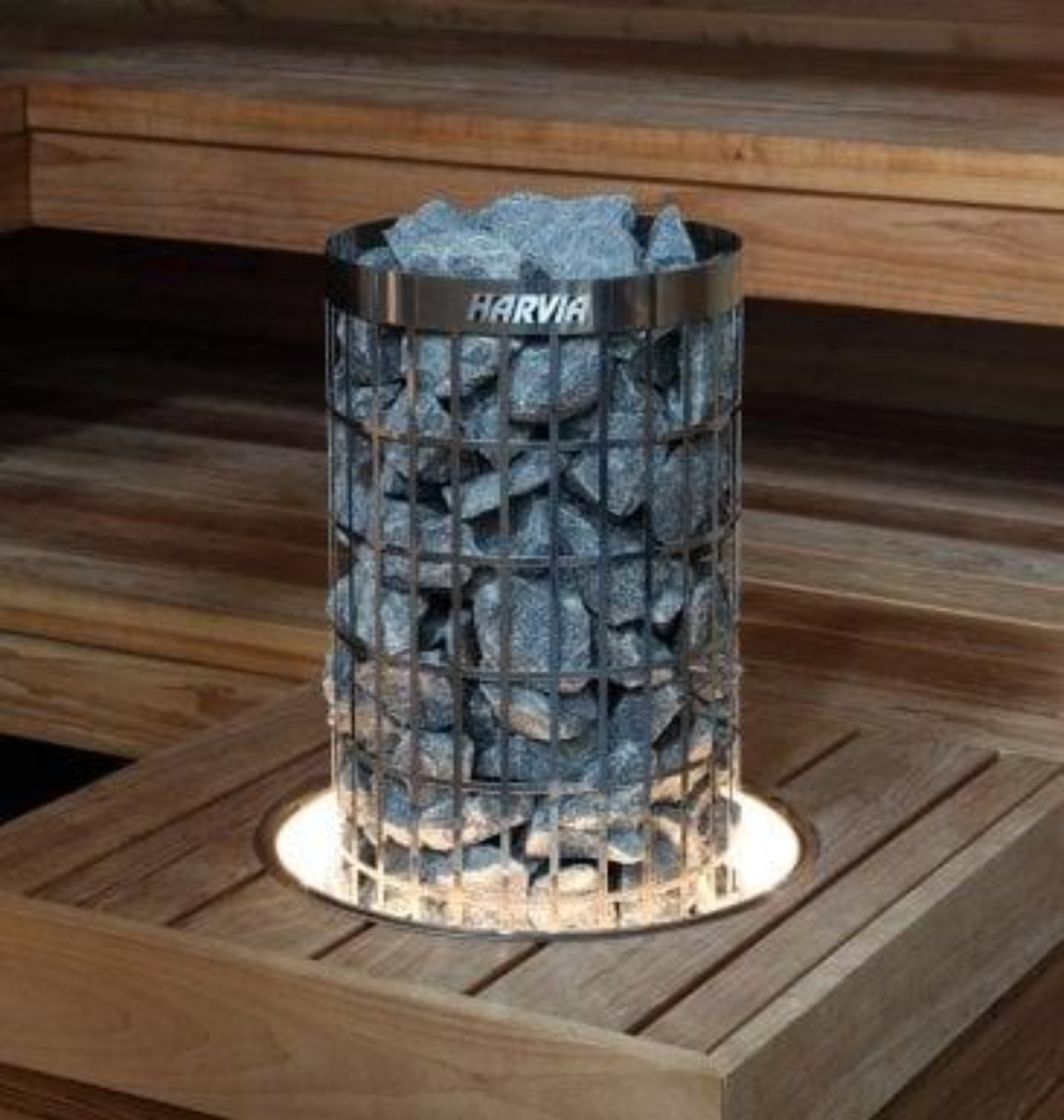 Harvia sauna stones in a metal container on a wooden surface