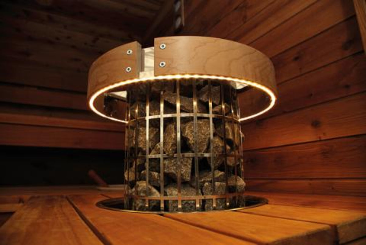 Harvia Safety Rail installed on a heater in a wooden sauna