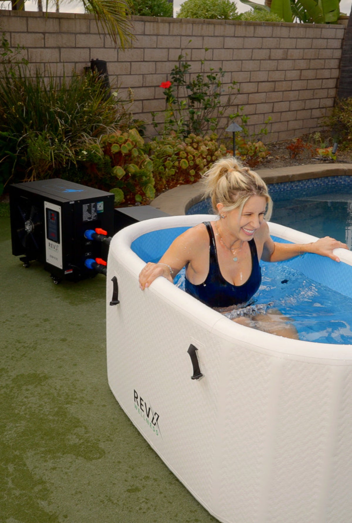 RevX inflatable cold plunge and filtration cabinet outdoors