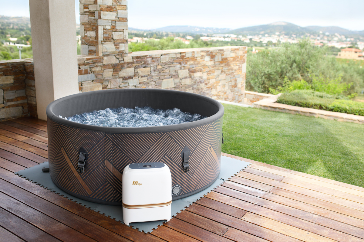 MSPA MONO Verto Series rigid hot tub set up in a scenic outdoor area for relaxation and comfort.