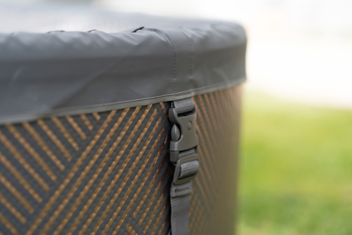 Close-up view of the rim and buckle detail of a rigid hot tub for outdoor relaxation and enjoyment.