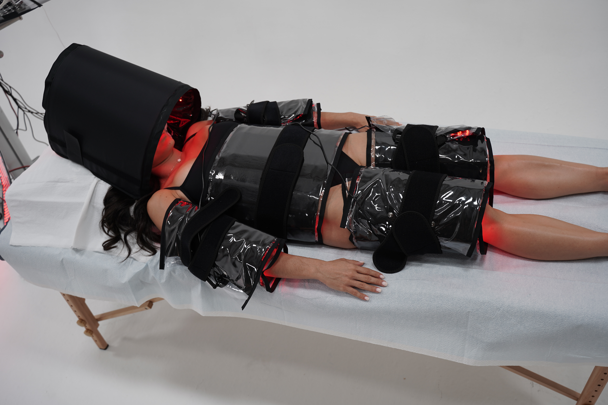 Model using Red Light Pro Devices full body red light therapy system for complete body coverage