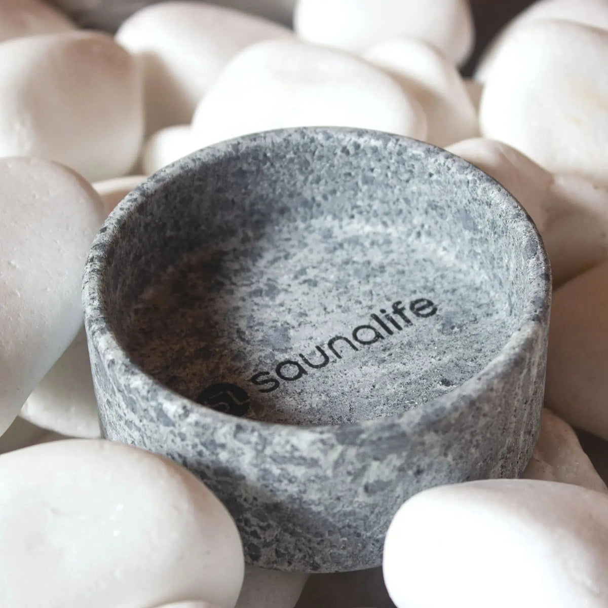 SaunaLife Coaster and Aroma Tray on white rocks