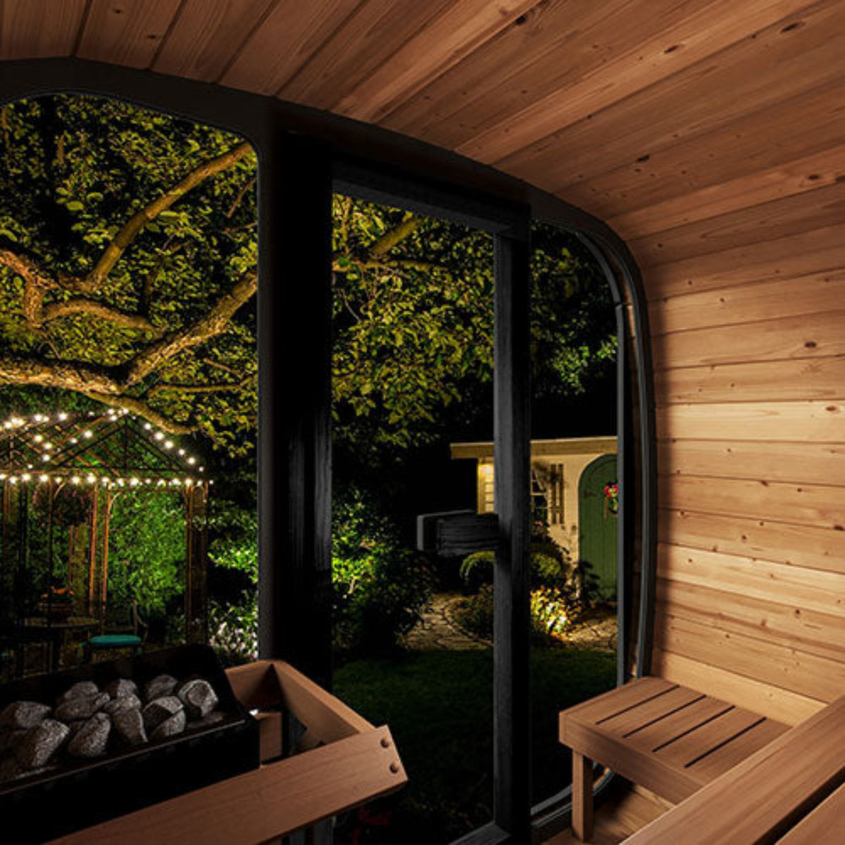 SaunaLife CUBE-Series Model CL5GB Outdoor Cube Sauna interior with outdoor garden view at night