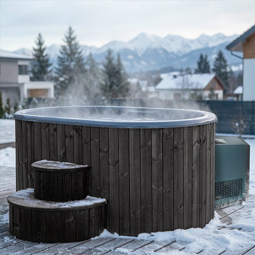 Outdoor hot and cold immersion tub surrounded by snow and mountains, steam rising from the water.