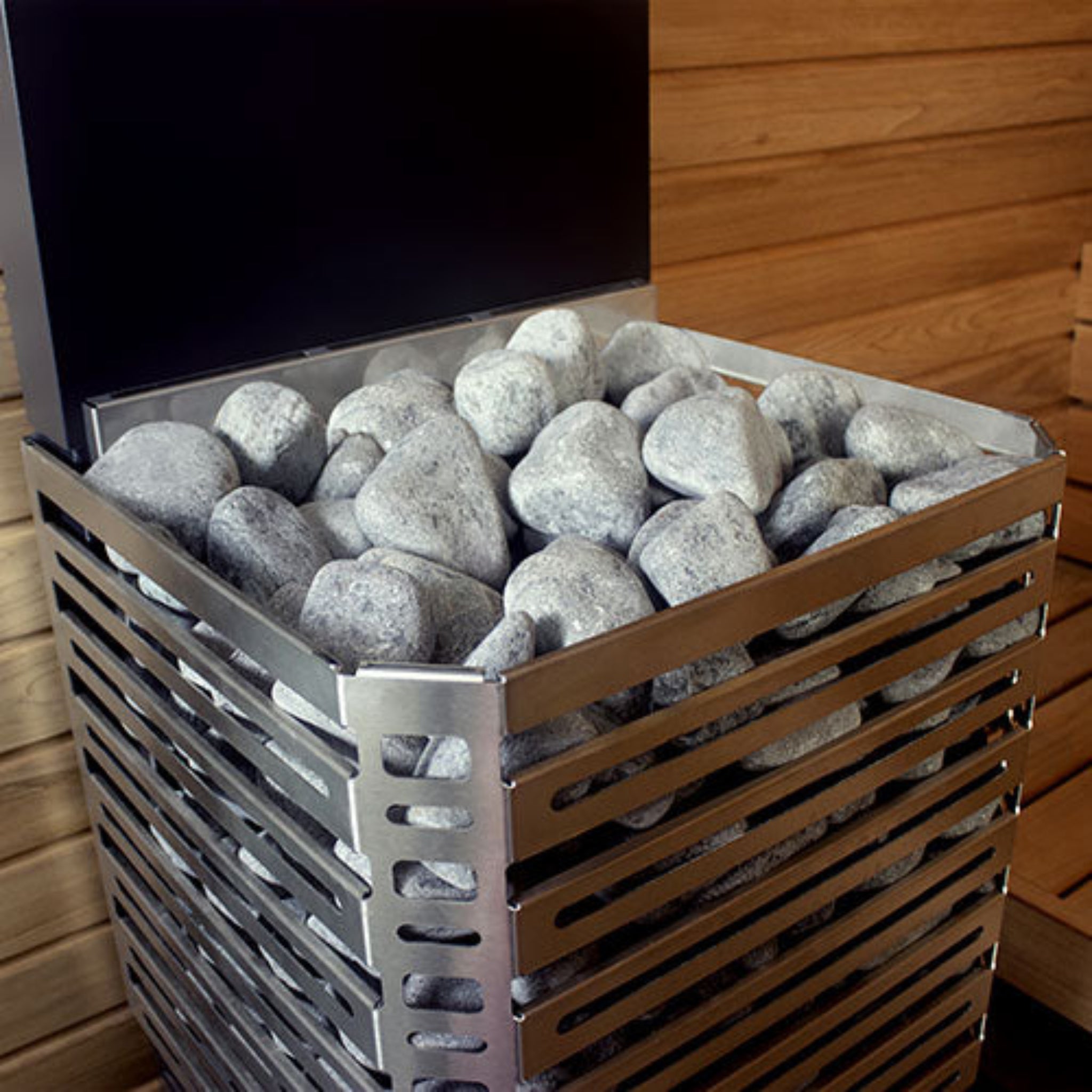 front angled side view of stones inside the Saunum Air sauna heater.  
