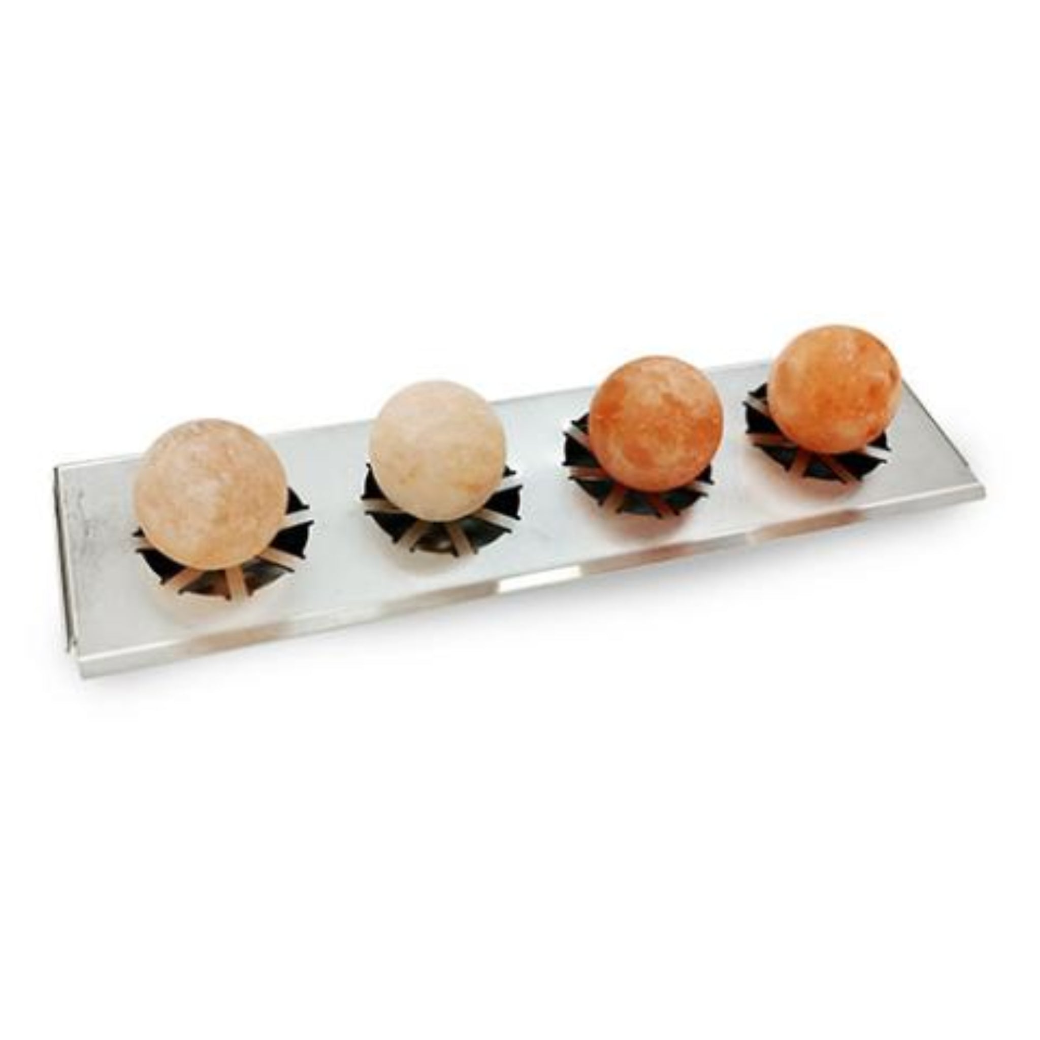 Four Saunum Himalayan salt stones on a metallic stand against a white background