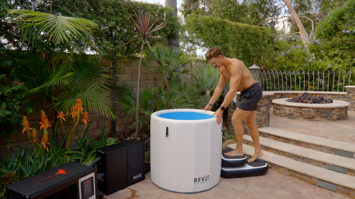 Person beside the RevX Inflatable Barrel outdoors
