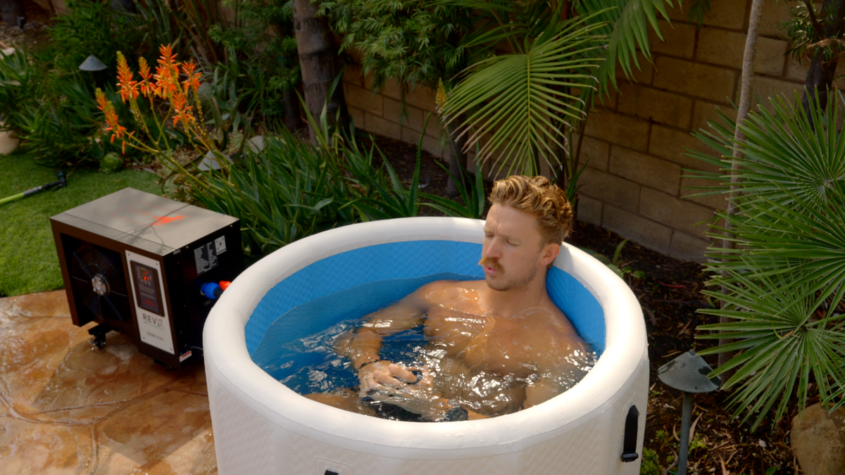 Person seated in the RevX Inflatable Barrel