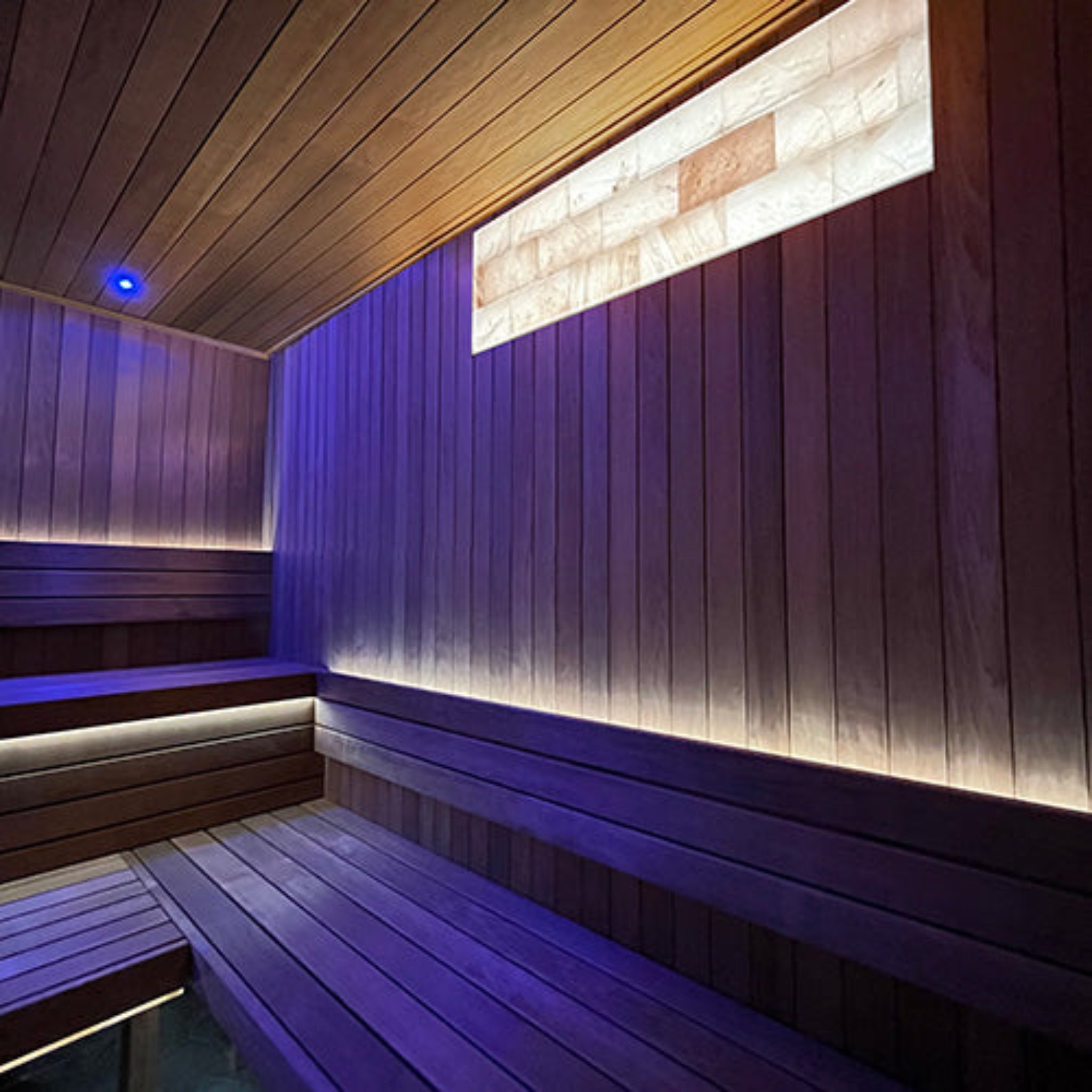 Wooden sauna interior with PROSAUNAS Universal On/Off White LED Himalayan Salt light Kit and benchs