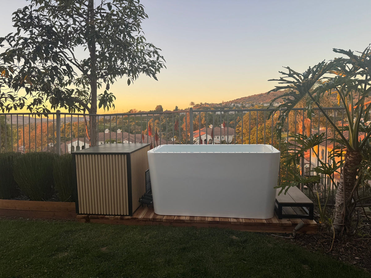 RevX Acrylic X Tub and LUX cabinet in a backyard at sunset
