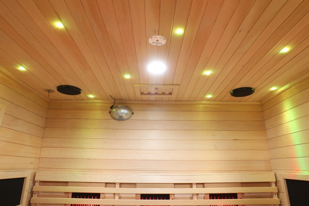 Interior view of Blisspod Venetian Full Spectrum Infrared Sauna showcasing lighting and wooden panels.