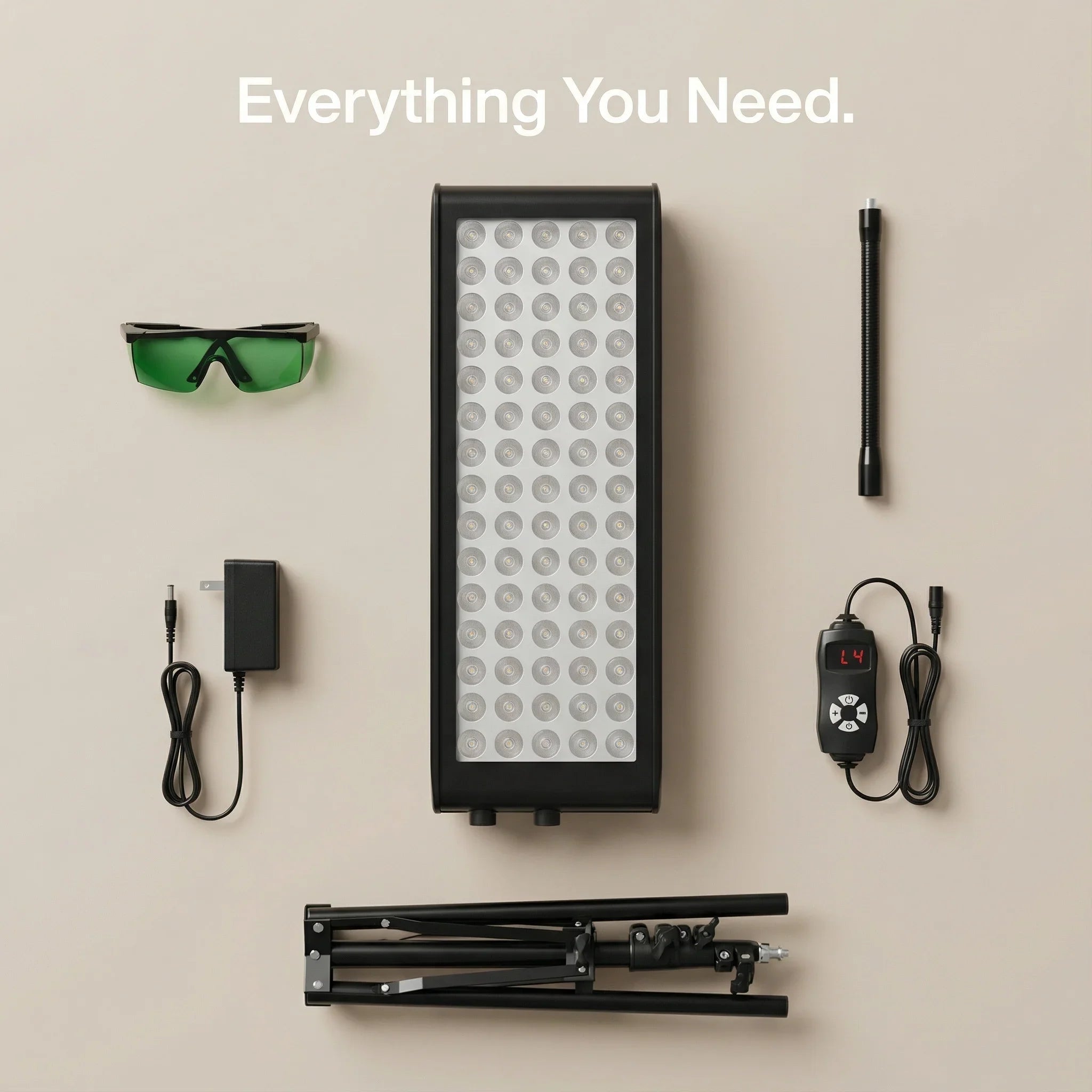What's included a light panel, stand, and accessories on a beige background