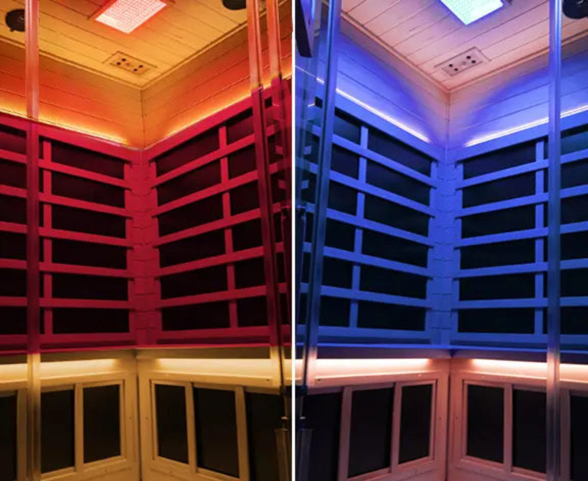 Interior view of a corner infrared sauna for 2-3 people with color changing lights and wooden paneling.