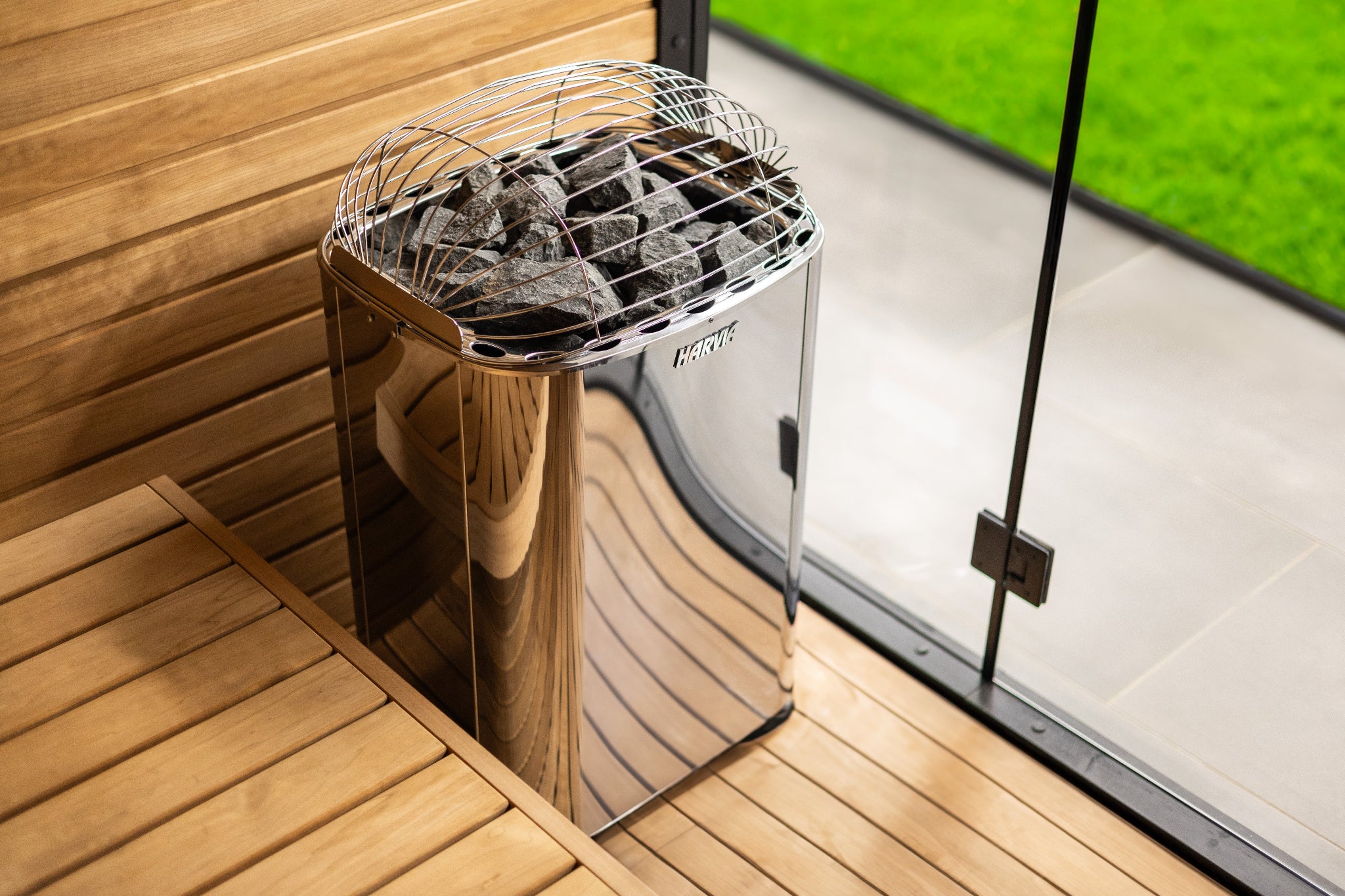 Harvia Club K10G sauna heater — quarter angle outdoor view showing stainless steel exterior
