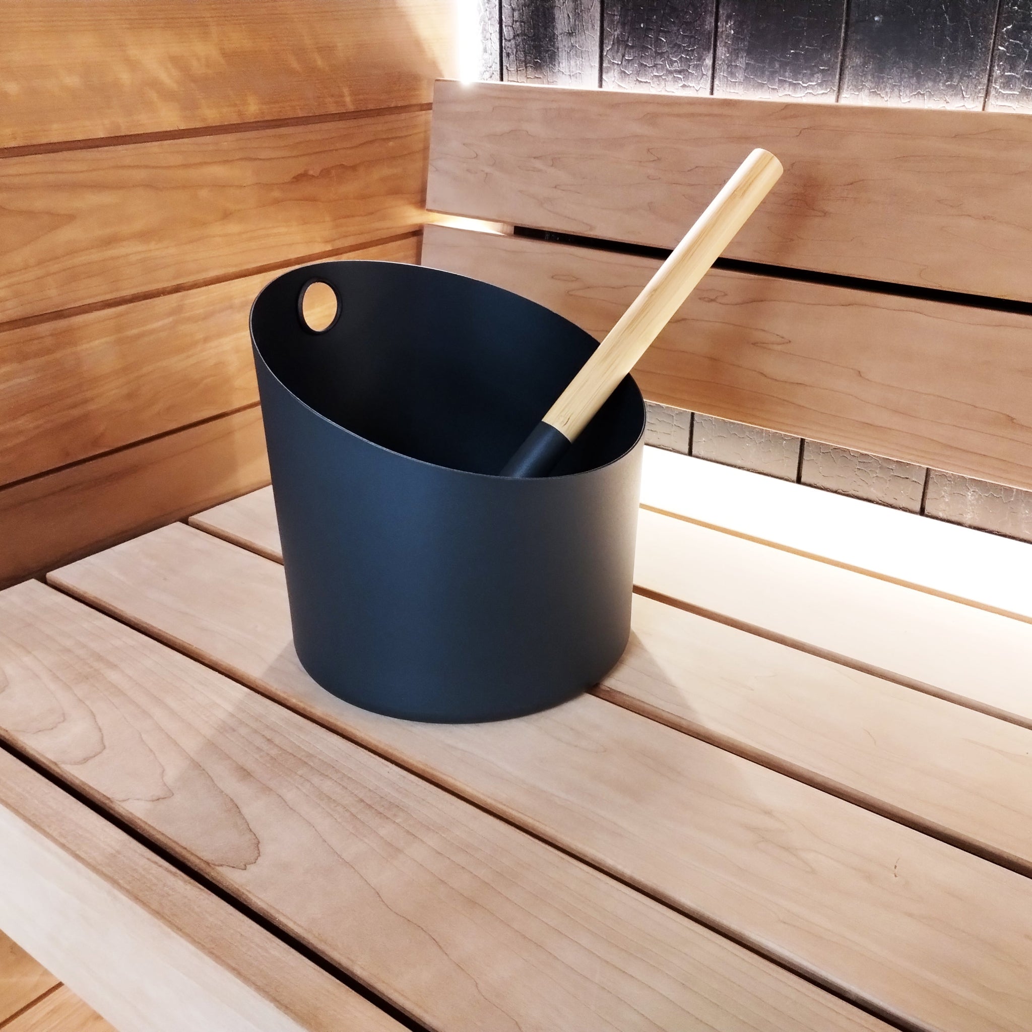 KOLO black sauna bucket and ladle — lifestyle view in sauna room