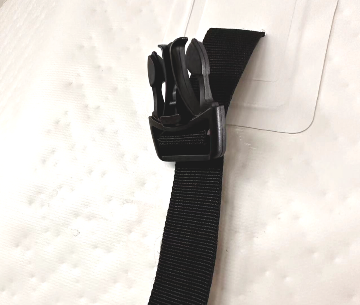Close-up of the RevX inflatable barrel lid buckle