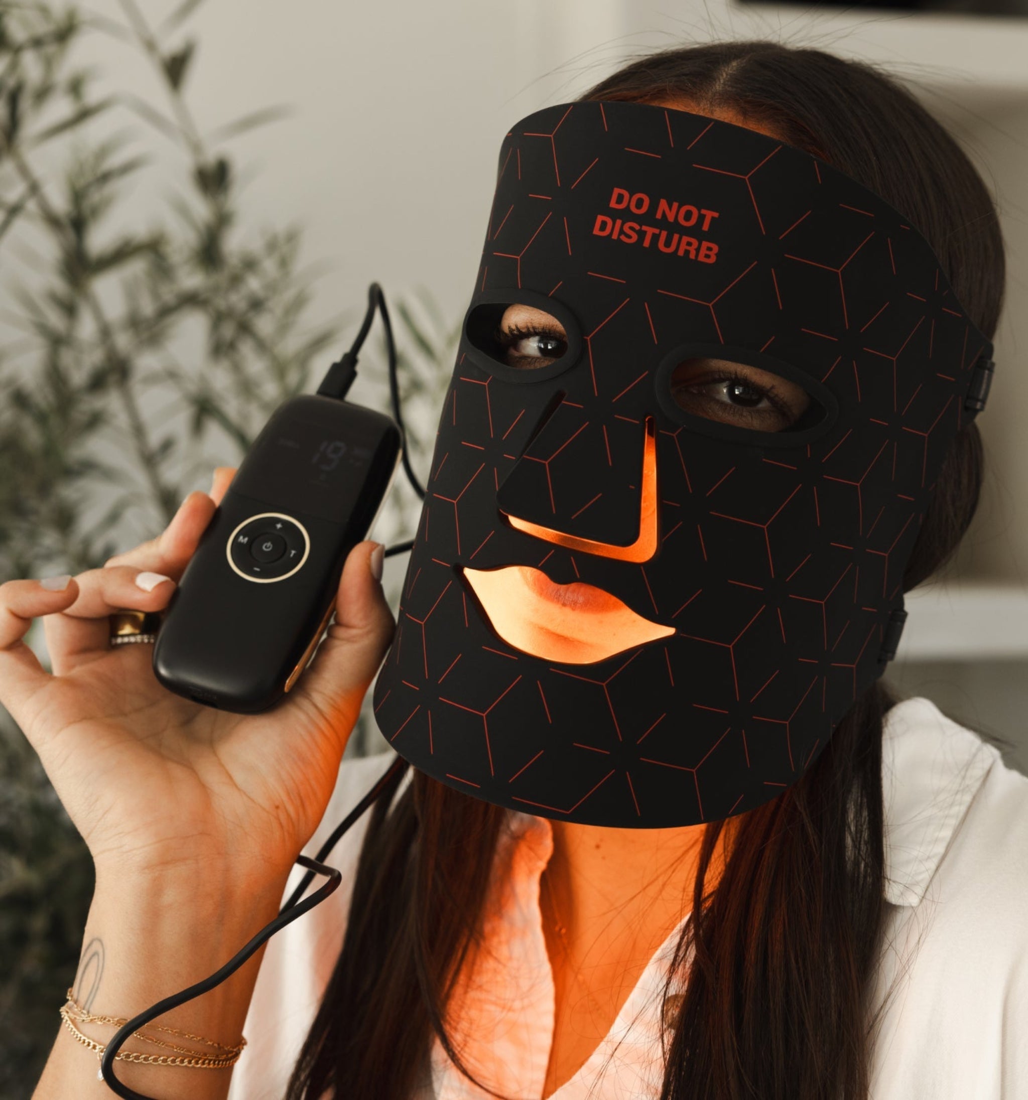 Renew Red Light LED Therapy Mask worn by woman in wellness studio – lifestyle shot