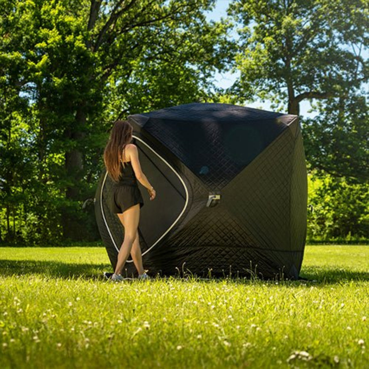SaunaLife SaunaTrekker Portable Sauna Tent iwith a woman with lush green background